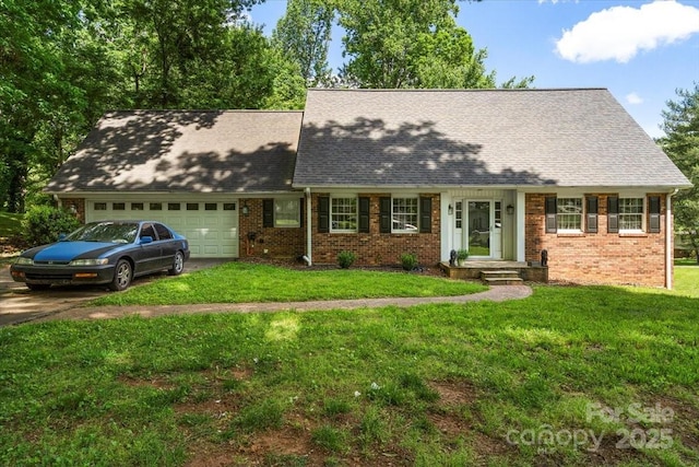 2701 Castes Dr, Pfafftown, NC 27040 - cape cod house featuring a garage, brick siding, roof with shingles, and a front lawn