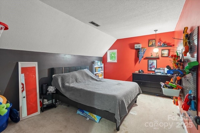 2701 Castes Dr, Pfafftown, NC 27040 - carpeted bedroom featuring a textured ceiling and vaulted ceiling