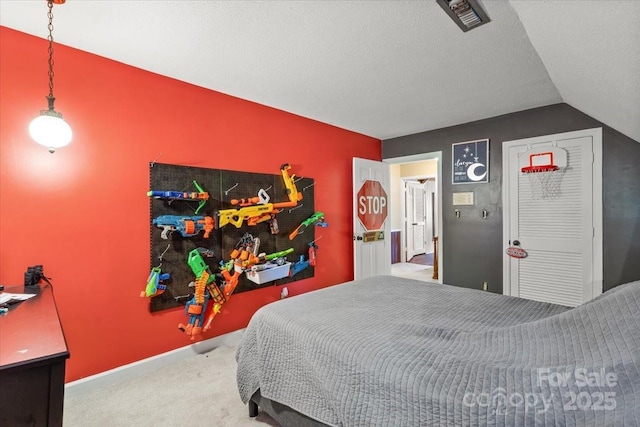 2701 Castes Dr, Pfafftown, NC 27040 - carpeted bedroom featuring lofted ceiling and baseboards