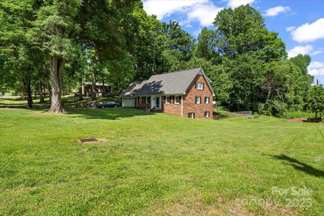 2701 Castes Dr, Pfafftown, NC 27040 - view of green lawn featuring a garage
