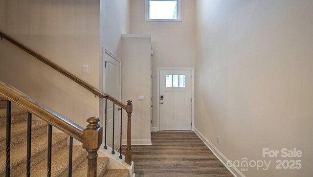 117 Sugg Trl, Weaverville, NC 28787 - entryway featuring a towering ceiling, baseboards, wood finished floors, and stairway