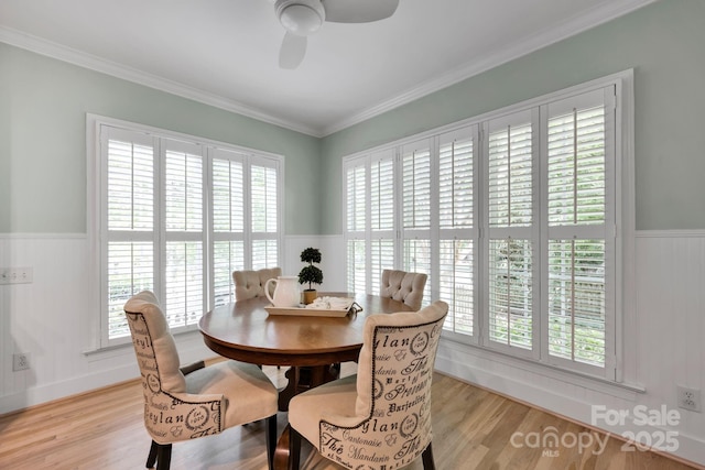 14505 Sunset Walk Ln, Huntersville, NC 28078 - dining space with a wainscoted wall, healthy amount of natural light, light wood-type flooring, and crown molding