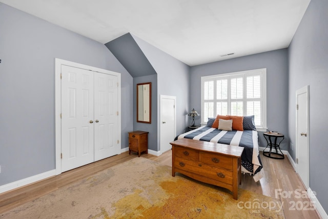 14505 Sunset Walk Ln, Huntersville, NC 28078 - bedroom featuring wood finished floors, a closet, and baseboards