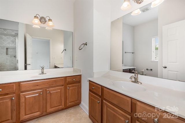full bathroom featuring two vanities and tile patterned flooring