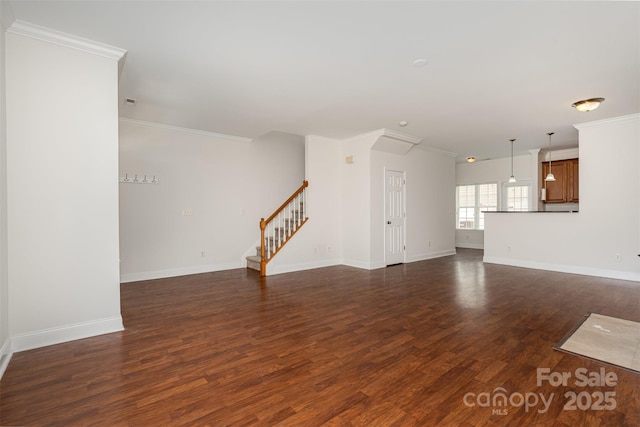 unfurnished living room with dark wood-style flooring, stairs, crown molding, and baseboards