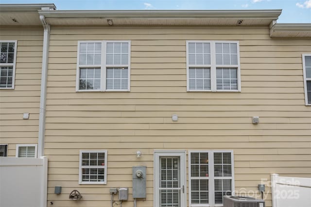 rear view of property with central air condition unit