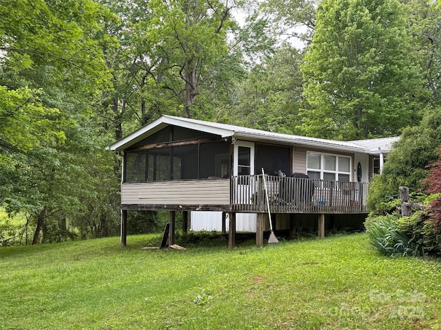 616/620 Pole Miller Ext, Brevard, NC 28712 - view of front of house featuring a sunroom, a front yard, metal roof, and a view of trees