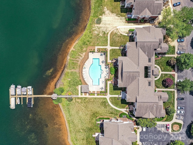aerial overview of property's location featuring a pool and a large body of water