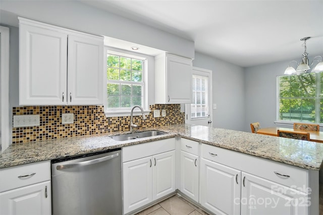 8014 Sherington Way, Charlotte, NC 28227 - kitchen with dishwasher, a sink, a peninsula, and backsplash