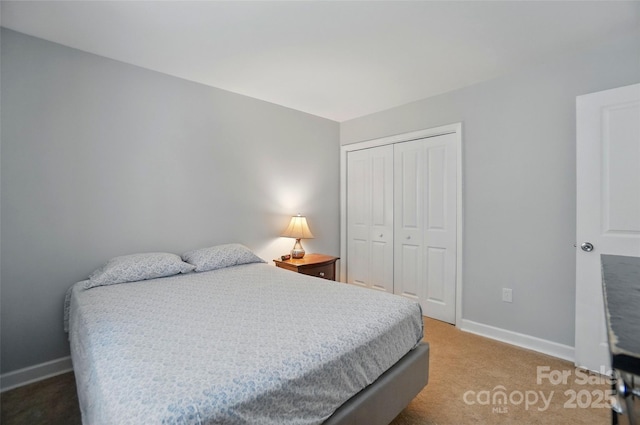 8014 Sherington Way, Charlotte, NC 28227 - bedroom featuring a closet, carpet floors, and baseboards