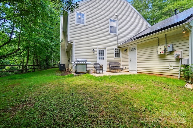 8014 Sherington Way, Charlotte, NC 28227 - rear view of house with a patio, central air condition unit, and roof mounted solar panels