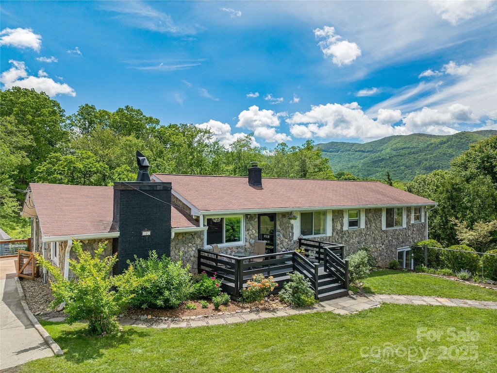 143 Mountain Crest Rd, Swannanoa, NC 28778 - single story home with a chimney, stone siding, a front yard, and a mountain view