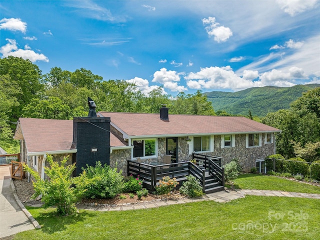 143 Mountain Crest Rd, Swannanoa, NC 28778 - single story home with a chimney, stone siding, a front yard, and a mountain view