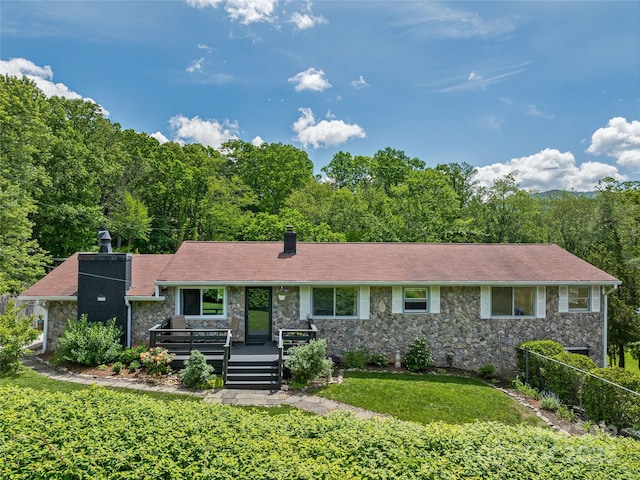 143 Mountain Crest Rd, Swannanoa, NC 28778 - ranch-style house featuring a chimney, stone siding, a front lawn, and a wooden deck