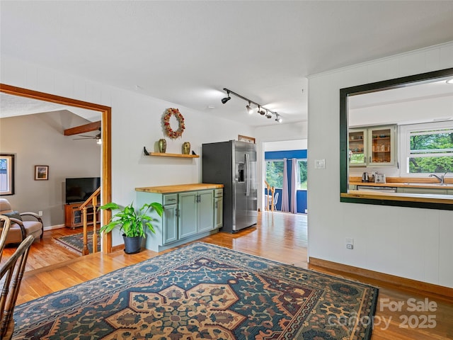 143 Mountain Crest Rd, Swannanoa, NC 28778 - living area with light wood-style floors, ceiling fan, baseboards, and bar area