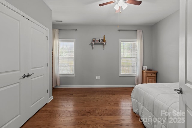1230 Long Creek Ln, Salisbury, NC 28146 - bedroom featuring multiple windows, wood finished floors, baseboards, and a ceiling fan