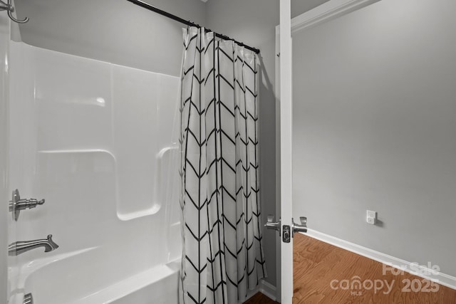 1230 Long Creek Ln, Salisbury, NC 28146 - bathroom with shower / bath combo, wood finished floors, and baseboards