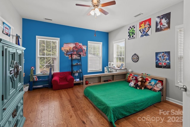 1230 Long Creek Ln, Salisbury, NC 28146 - bedroom with wood finished floors, multiple windows, a ceiling fan, and baseboards