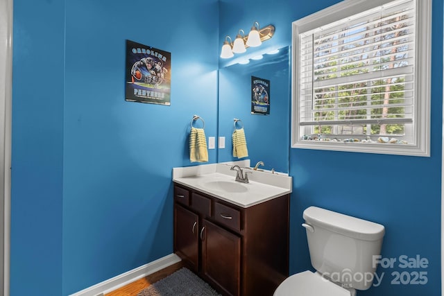 1230 Long Creek Ln, Salisbury, NC 28146 - bathroom featuring toilet, vanity, wood finished floors, and baseboards