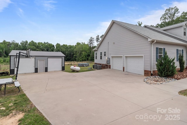 1230 Long Creek Ln, Salisbury, NC 28146 - view of property exterior with a garage and central AC unit