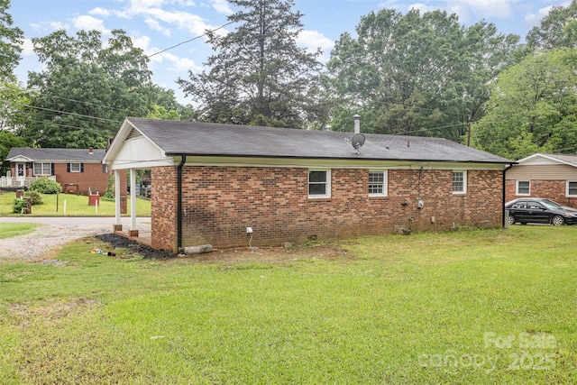 16 Green St, York, SC 29745 - view of side of property featuring a lawn, brick siding, and a shingled roof