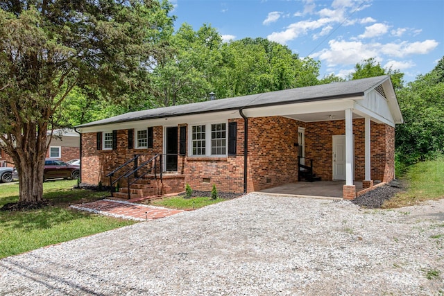 16 Green St, York, SC 29745 - single story home featuring gravel driveway, an attached carport, and brick siding