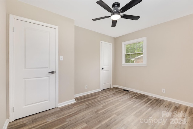 16 Green St, York, SC 29745 - unfurnished bedroom featuring light wood-style flooring, baseboards, and ceiling fan