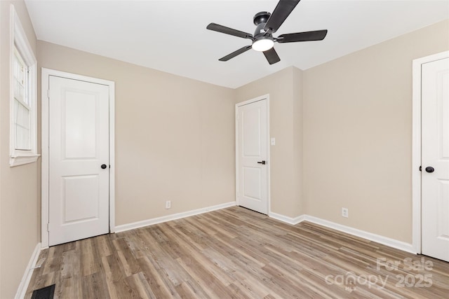 16 Green St, York, SC 29745 - unfurnished bedroom featuring light wood-type flooring, baseboards, and a ceiling fan