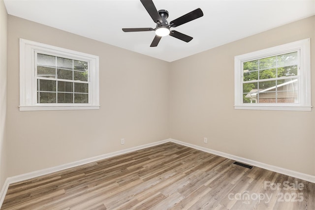 16 Green St, York, SC 29745 - spare room with wood finished floors, baseboards, and ceiling fan