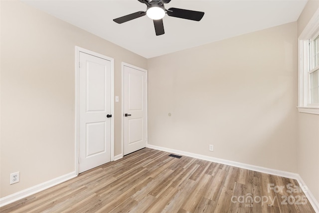 16 Green St, York, SC 29745 - unfurnished bedroom featuring light wood-style floors, baseboards, and a ceiling fan