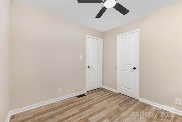 16 Green St, York, SC 29745 - unfurnished bedroom with light wood-style flooring, baseboards, and a ceiling fan
