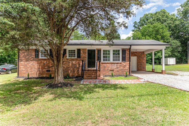 16 Green St, York, SC 29745 - ranch-style home featuring a storage shed, brick siding, an outdoor structure, a front lawn, and driveway