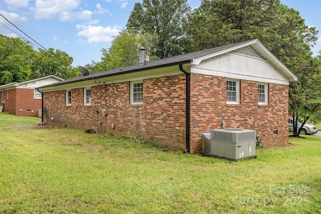 16 Green St, York, SC 29745 - view of home's exterior with cooling unit, brick siding, and a lawn