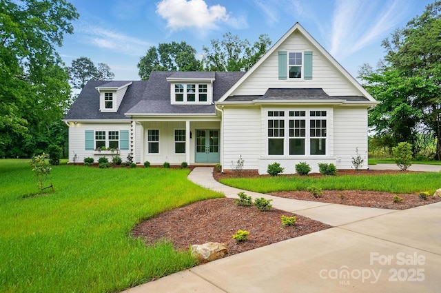 9311 Simpson Rd, Waxhaw, NC 28173 - view of front of house with a front yard, roof with shingles, and french doors