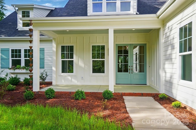 9311 Simpson Rd, Waxhaw, NC 28173 - view of exterior entry featuring a shingled roof, french doors, and board and batten siding