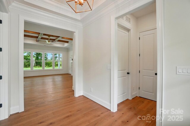 9311 Simpson Rd, Waxhaw, NC 28173 - corridor with coffered ceiling, light wood-style flooring, a chandelier, baseboards, and ornamental molding