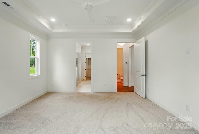 9311 Simpson Rd, Waxhaw, NC 28173 - unfurnished bedroom featuring a tray ceiling, crown molding, carpet floors, baseboards, and recessed lighting