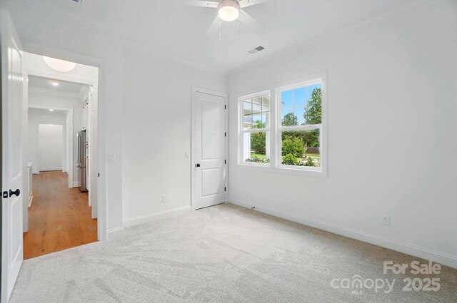 9311 Simpson Rd, Waxhaw, NC 28173 - unfurnished bedroom with ornamental molding, carpet, baseboards, and ceiling fan
