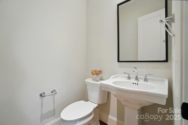 9311 Simpson Rd, Waxhaw, NC 28173 - bathroom with toilet and baseboards