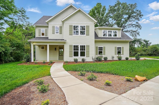 9315 Simpson Rd, Waxhaw, NC 28173 - traditional home featuring a front lawn, a shingled roof, and a porch