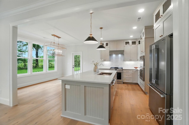 9315 Simpson Rd, Waxhaw, NC 28173 - kitchen with premium appliances, a sink, a center island with sink, light wood finished floors, and recessed lighting
