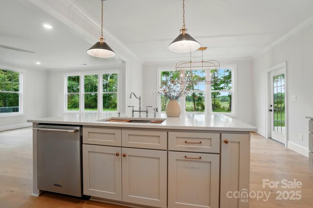 9315 Simpson Rd, Waxhaw, NC 28173 - kitchen with dishwasher, ornamental molding, light wood finished floors, a sink, and light countertops