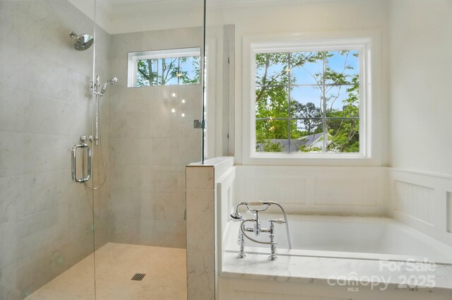 9315 Simpson Rd, Waxhaw, NC 28173 - bathroom with a shower stall, a garden tub, and a decorative wall