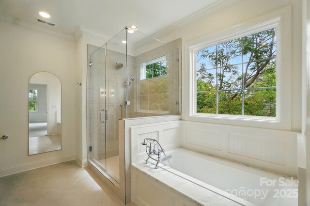 9315 Simpson Rd, Waxhaw, NC 28173 - full bathroom with crown molding, a shower stall, a garden tub, and recessed lighting