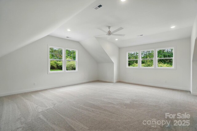 9315 Simpson Rd, Waxhaw, NC 28173 - additional living space featuring light carpet, baseboards, lofted ceiling, ceiling fan, and recessed lighting