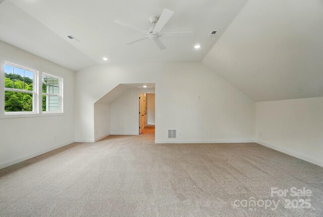 9315 Simpson Rd, Waxhaw, NC 28173 - additional living space featuring light carpet, a ceiling fan, vaulted ceiling, baseboards, and recessed lighting