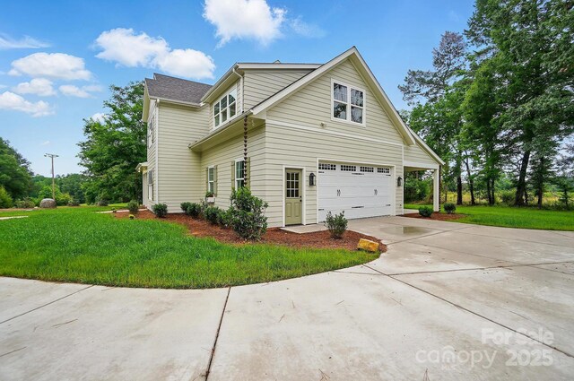 9315 Simpson Rd, Waxhaw, NC 28173 - view of property exterior featuring driveway, a garage, and a yard
