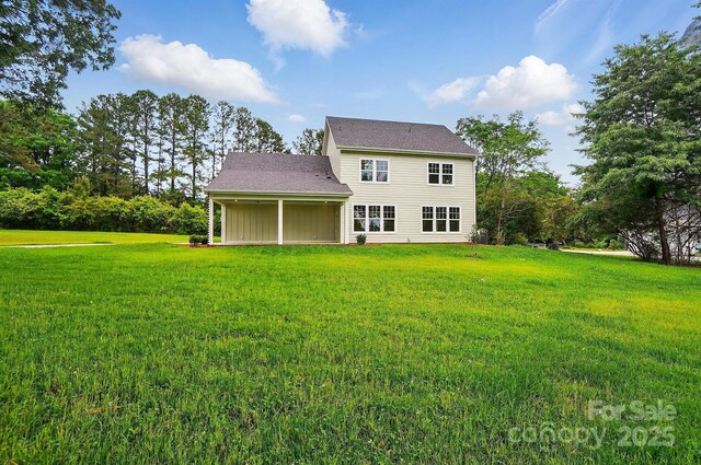 9315 Simpson Rd, Waxhaw, NC 28173 - rear view of property featuring a lawn