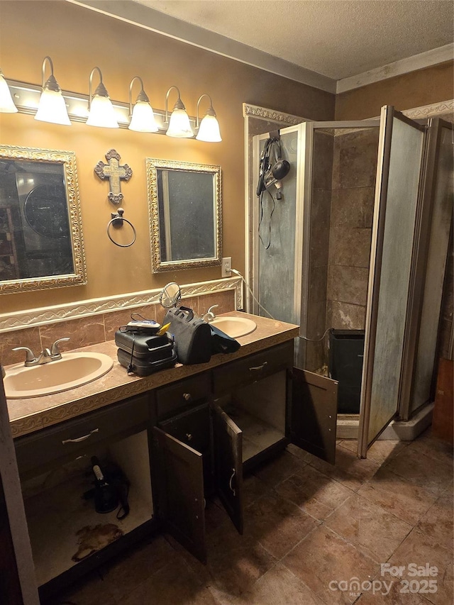 29386 Nelson Mountain Rd, Albemarle, NC 28001 - full bathroom featuring a stall shower, double vanity, a textured ceiling, and tile patterned flooring