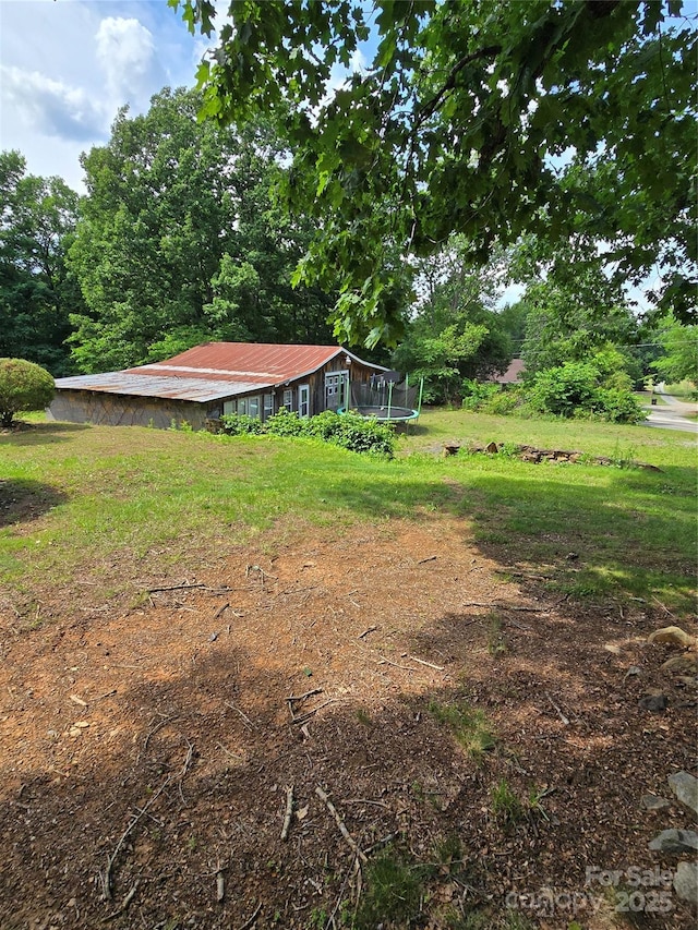 29386 Nelson Mountain Rd, Albemarle, NC 28001 - view of green lawn with a trampoline